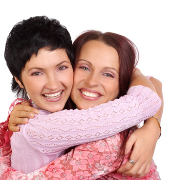 Two ladies smiling.