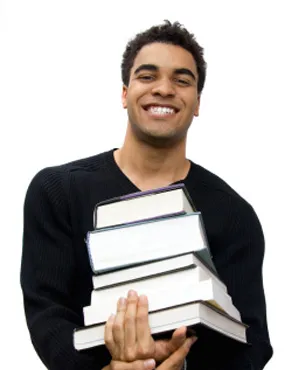 A man holding some books, smiling.